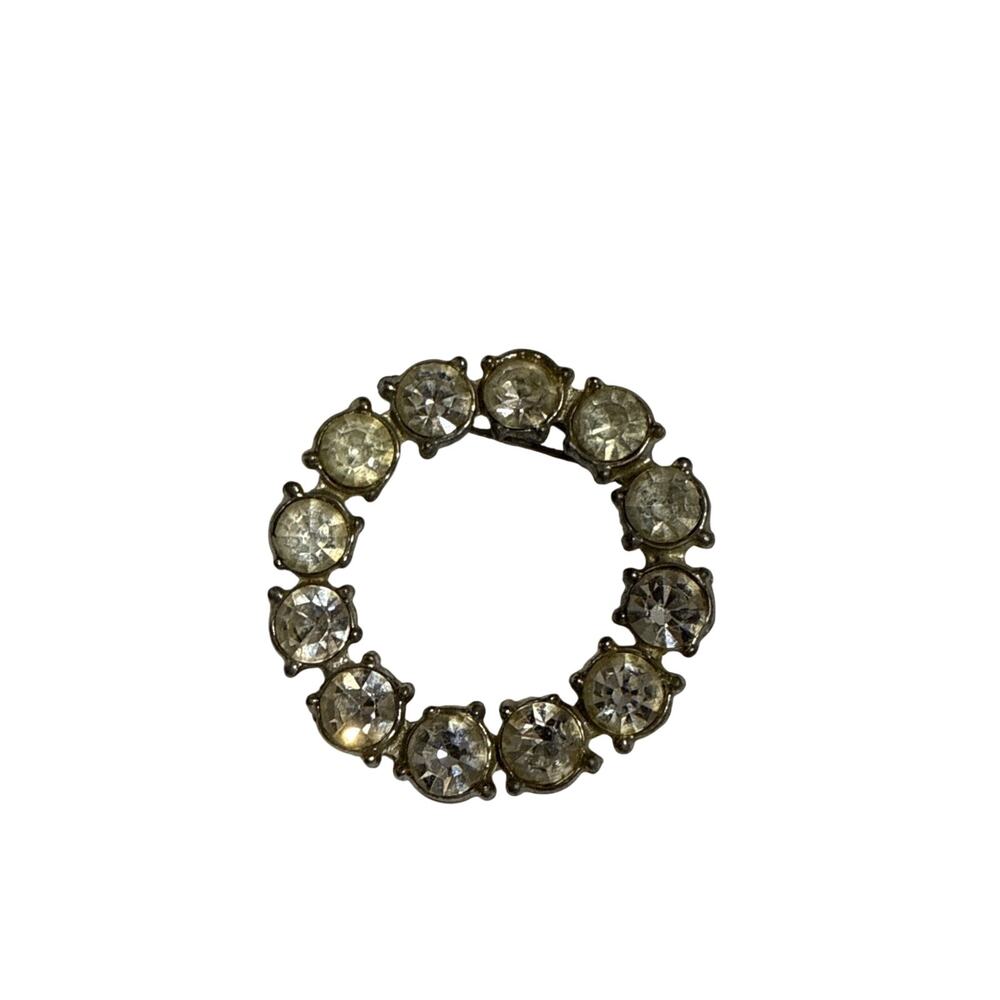 Vintage Weingeroff clear rhinestone circle brooch.
